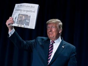 Trump brandishes 'Acquitted'